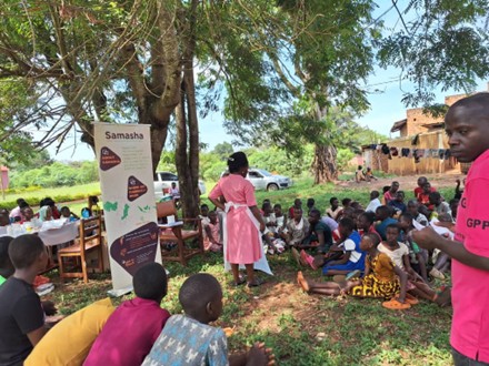 Samasha Medical Foundation community health outreach under a tree in Uganda