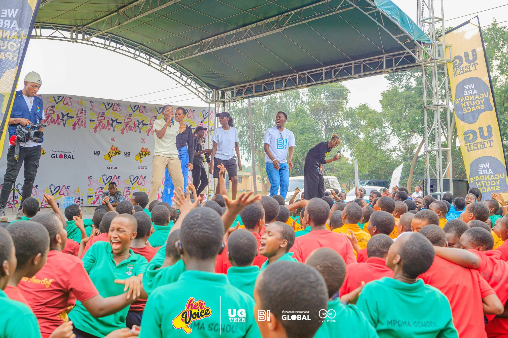 UG Teens outdoor youth stage event with school children in Uganda